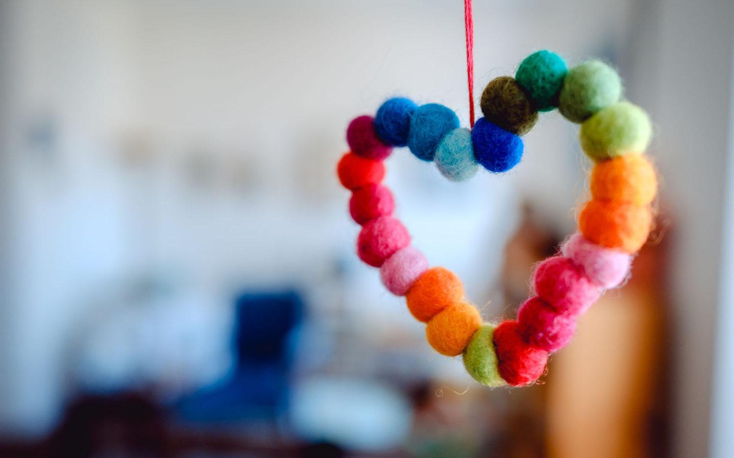 multi-coloured heart made from balls of warn