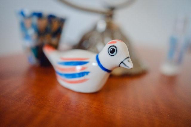 glass bird sitting on table